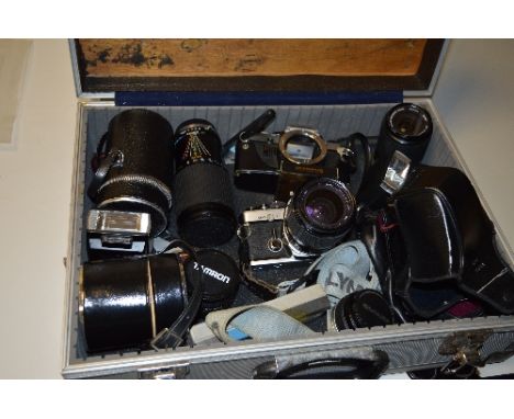 AN ALUMINIUM CAMERA CASE OF OLYMPUS SLR LENSES AND FLASHES, an OM10, an OM2N, an Auto 50mm, an Auto-W 28mm, a Vivitar 70-210m