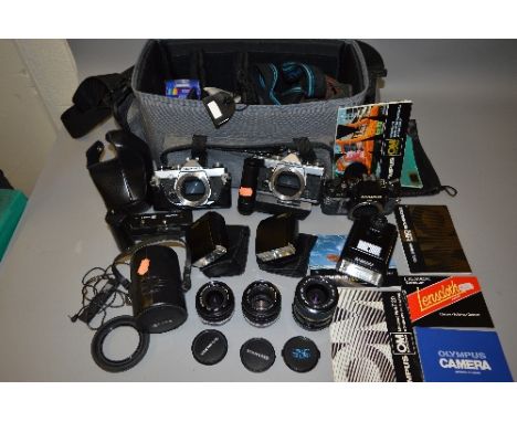 A CAMERA BAG CONTAINING OLYMPUS CAMERA EQUIPMENT, two Olympus OM1 MD SLR's, two OM winder 2.2 T20 and a T32 flashes, an OM40 