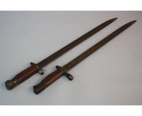 TWO WWI ERA RIFLE BAYONETS, first one a British Army issue SMLE bayonet by Wilkinson, marked with Crown and GR and proofing m