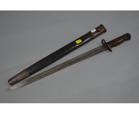 A WWI ERA RIFLE BAYONET AND SCABBARD, marked on riccasso 1907 Crown & CR, also proof marks evident, British issue