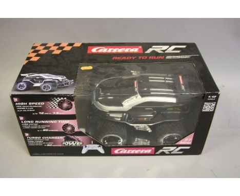 A BOXED CARRERA RC RADIO CONTROL BLACK ENFORCER CAR, No.180109, not tested, 1:18 scale, appears to have hardly ever been remo