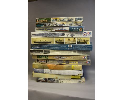 A COLLECTION OF 13 SCALE MODEL WARSHIPS AND MERCHANT SHIPS, 1 x Heller Bismark, scale 1:400, box opened. 1 x Hasegawa Tirpitz