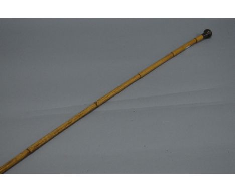 A BAMBOO MILITARY SWAGGER STICK, with hallmarked silver top, good condition