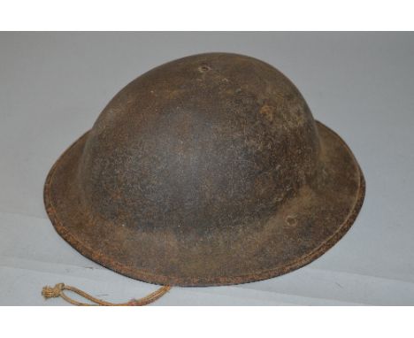 A WWI ERA BRITISH INFANTRY HELMET, marked to underside 'HS' the helmet retains its inner liner with netting buckle and chain