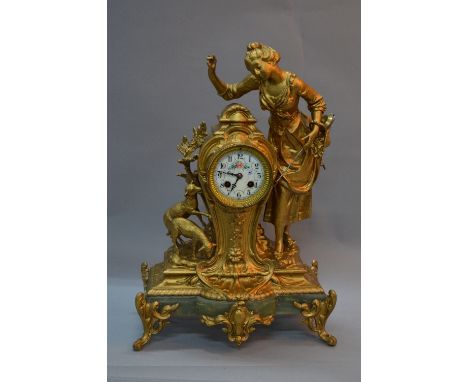 A LATE 19TH CENTURY FRENCH GILT METAL FIGURAL MANTEL CLOCK, cast with a girl and two lambs flanking the circular porcelain di