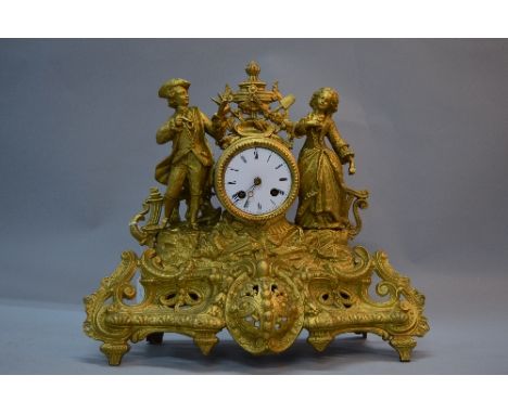 A LATE 19TH CENTURY FRENCH GILT METAL EIGHT DAY MANTEL CLOCK BY MARTI &amp; CO, the ornate case cast with an 18th Century art