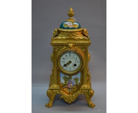 A LATE 19TH CENTURY FRENCH GILT METAL MANTEL CLOCK OF RECTANGULAR FORM, pineapple finial above a green painted porcelain dome