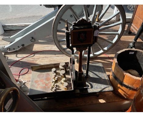 W &amp; T AVERY; a set of cast iron balance scales with assorted weights, to weigh 56lbs, height 74cm, length 69cm.