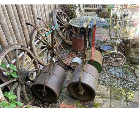 Three vintage garden rollers, and a cricket marking roller (4) 