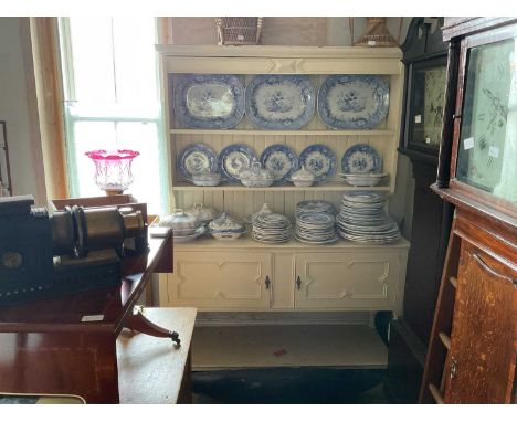 A 19th century white painted dresser with boarded plate rack back above two cupboard doors and undertier shelf, width 152cm, 