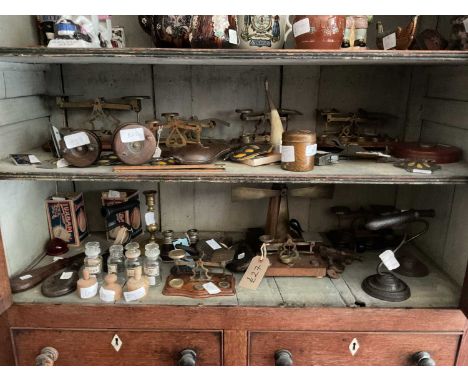 An assorted of collectors' items to include eight sets of postal scales, fishing reels, AA car badges, gophering irons, adver