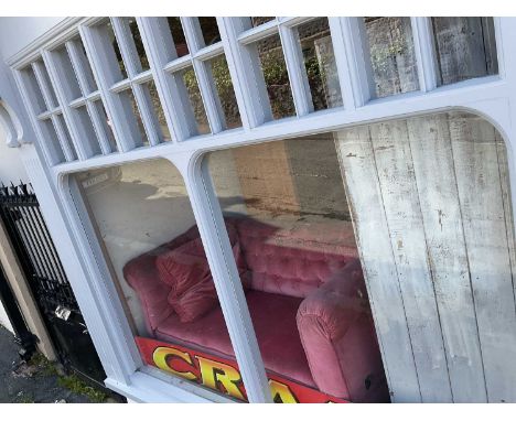 A Victorian drop-end Chesterfield type sofa, upholstered in a salmon pink material.Condition Report: The right hand side drop