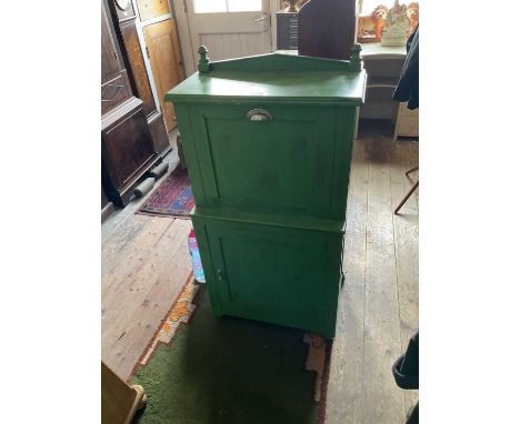 A painted teak ship's/travelling washstand, the hinged cover enclosing a mirror with pull-down front containing a ceramic bas