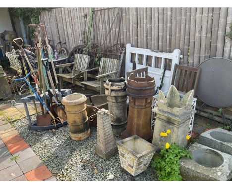 A collection of assorted garden related items, including chimney pots, garden tools, white painted metal table, two seater ga