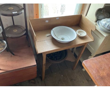 An old pine washstand with raised back, with associated enamel bowl and ceramic soap dish, on block legs, width 84cm, depth 4