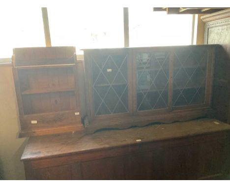 A modern oak dwarf bookcase with leaded glazed doors on shaped base, width 132cm, height 74cm, with a modern pine hanging she