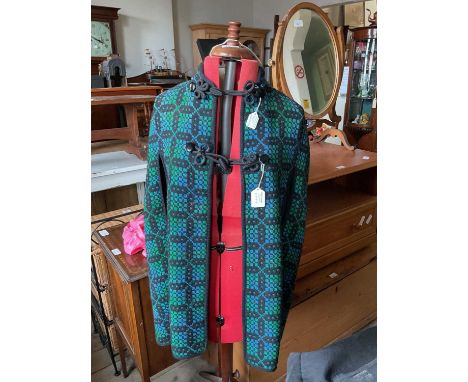 A vintage expandable tailors' dummy, with a mannequin, and two vintage coats (4)