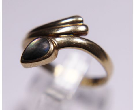 9ct yellow gold crossover ring with set moonstone, size T