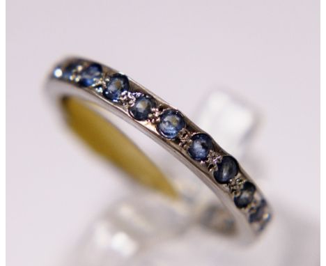 Sterling silver blue stone set full eternity ring, size P