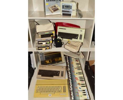 A SELECTION OF COMMODORE VINTAGE PERSONAL COMPUTERS AND ACCESSORIES, this includes two 64s, a VC 20, an MPS 801 printer, thre