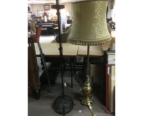 A brass standard lamp plus a wrought iron example (approx heights 153cm and 150cm.