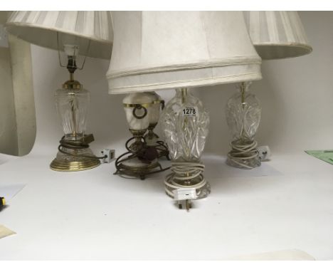 A pair of cut glass and brass table lamps one other similar lamp and a pair of modern marble lamps. With four shades.