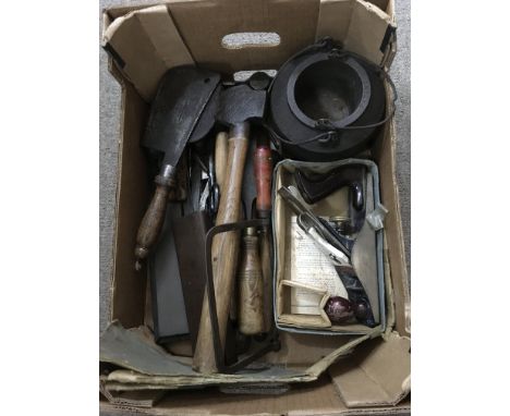 A box of woodworking tools including a Record plane and meat cleaver