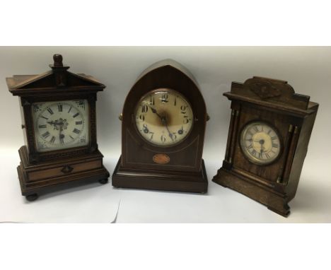 A 19th century wooden lancer cased mantle clock with key and pendulum, and two other 19th century wood cased clocks.