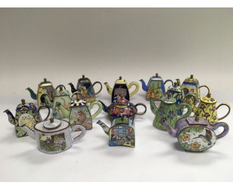 A collection of miniature enamel teapots.