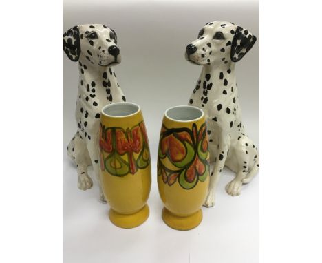 A pair of ceramic figures of dalmation dog, approx 34.5cm, together with a pair of Poole vases, approx 22.5cm.