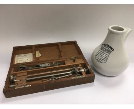 A cased medical equipment item, possibly a lithotrite, together with a ceramic 'Dr Nelson's Improved inhaler'.