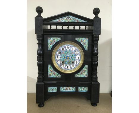 An 8 day aesthetic mantle clock with ceramic clock face and decoration, approx 33.5cm x 16.5cm x 52.5cm.