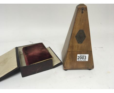 A French Metronome and a velvet covered bible in a fitted case. (2)