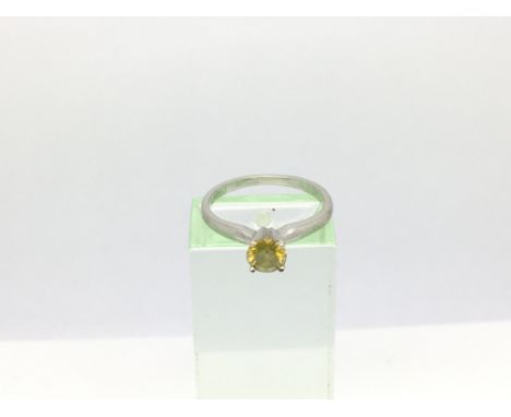 A 9ct white gold solitaire diamond ring set with a yellow diamond , approx.30ct, approx 1.9g and approx size J-K.