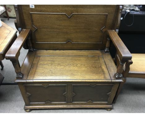 A oaks monks bench with lift up seat and panel front.