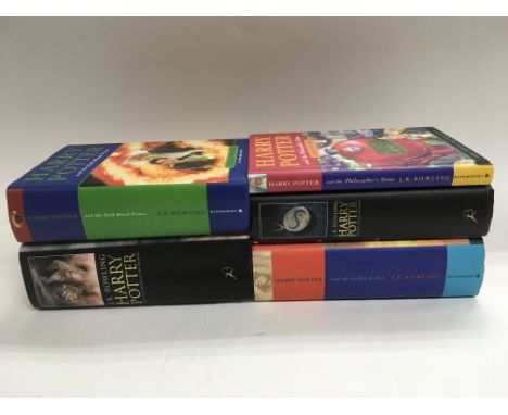 Five Harry Potter first edition books.