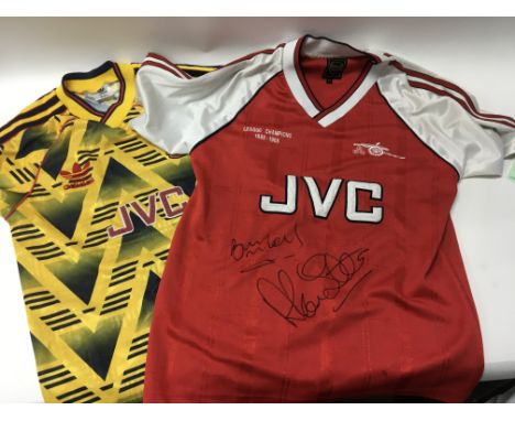 A pair of XS Arsenal football shirts, including one 1988-89 league champions shirt possibly signed by Alan Smith and some Ars