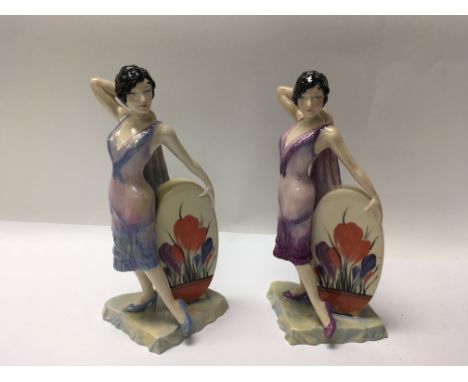 A pair of Carlton Ware Clarice Cliff Sunshine Girl figures. Height approx 25cm.