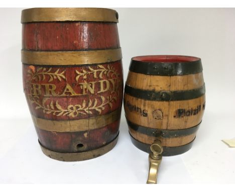 A collection of brewery advertising item together with a Brandy barrel