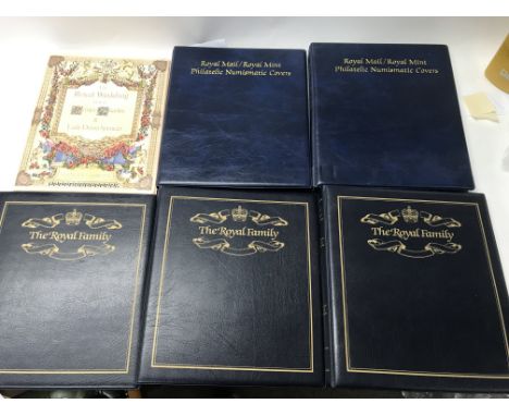 A group of 5 albums of first day covers, including Royal Family first day covers and one more album of stamps about the Royal