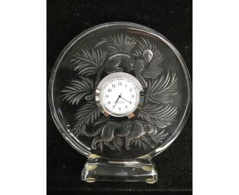 A Lalique glass mantle clock decorated with two leopards, approx height 14cm.