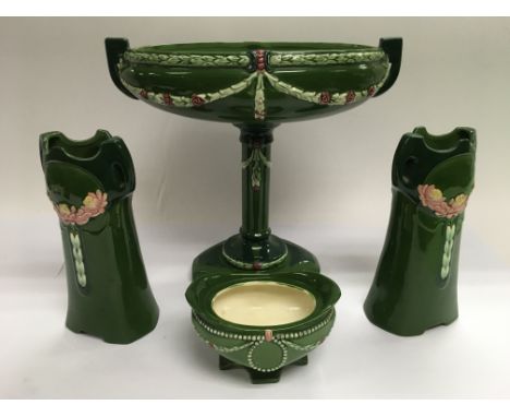 A four piece Art Nouveau ceramic set comprising a pair of vases, comport etc.