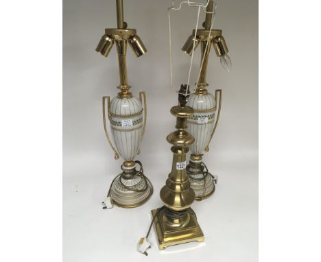 Two Quality modern porcelain and gilt metal lamps and a brass table lamp sold with shades for recovering. Height 80cm. (3)