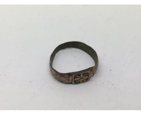 A small metal ring, possibly late medieval, approx J-K.