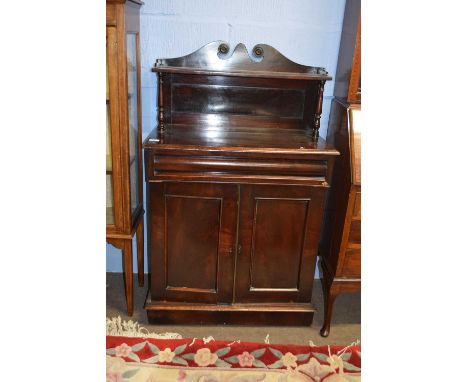 Small 19th century mahogany chiffonier with broken arch pediment over a single shelf, the body with a frieze drawer and two p