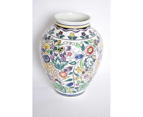 A Poole pottery vase the baluster body with a pattern of deer amongst geometric flowers (restored)35cm highRestoration to rim