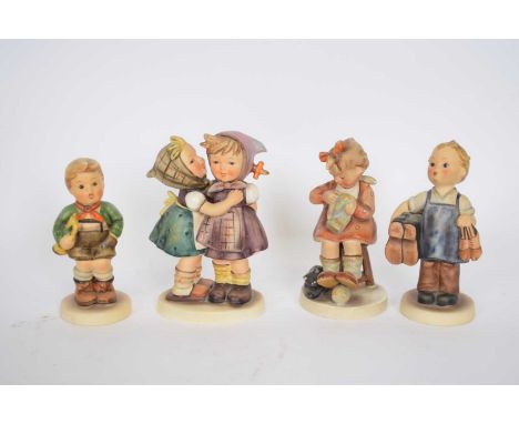 Group of four Goebel figures of children, designed by Hummel, including Boots and others (4)