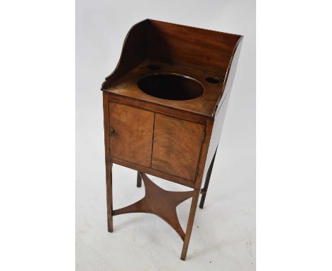 19th century mahogany wash stand of square form with galleried back, three apertures and a single door over a base shelf, 97c