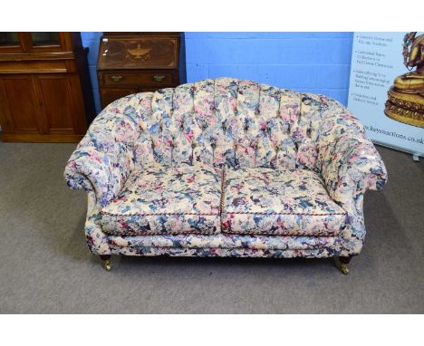 Lincoln House floral upholstered two-seater sofa with buttoned back and sides, 160cm wide