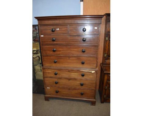 Late Georgian mahogany chest on chest formed in two sections raised on bracket feet, fitted with later knob handles, 117cm wi